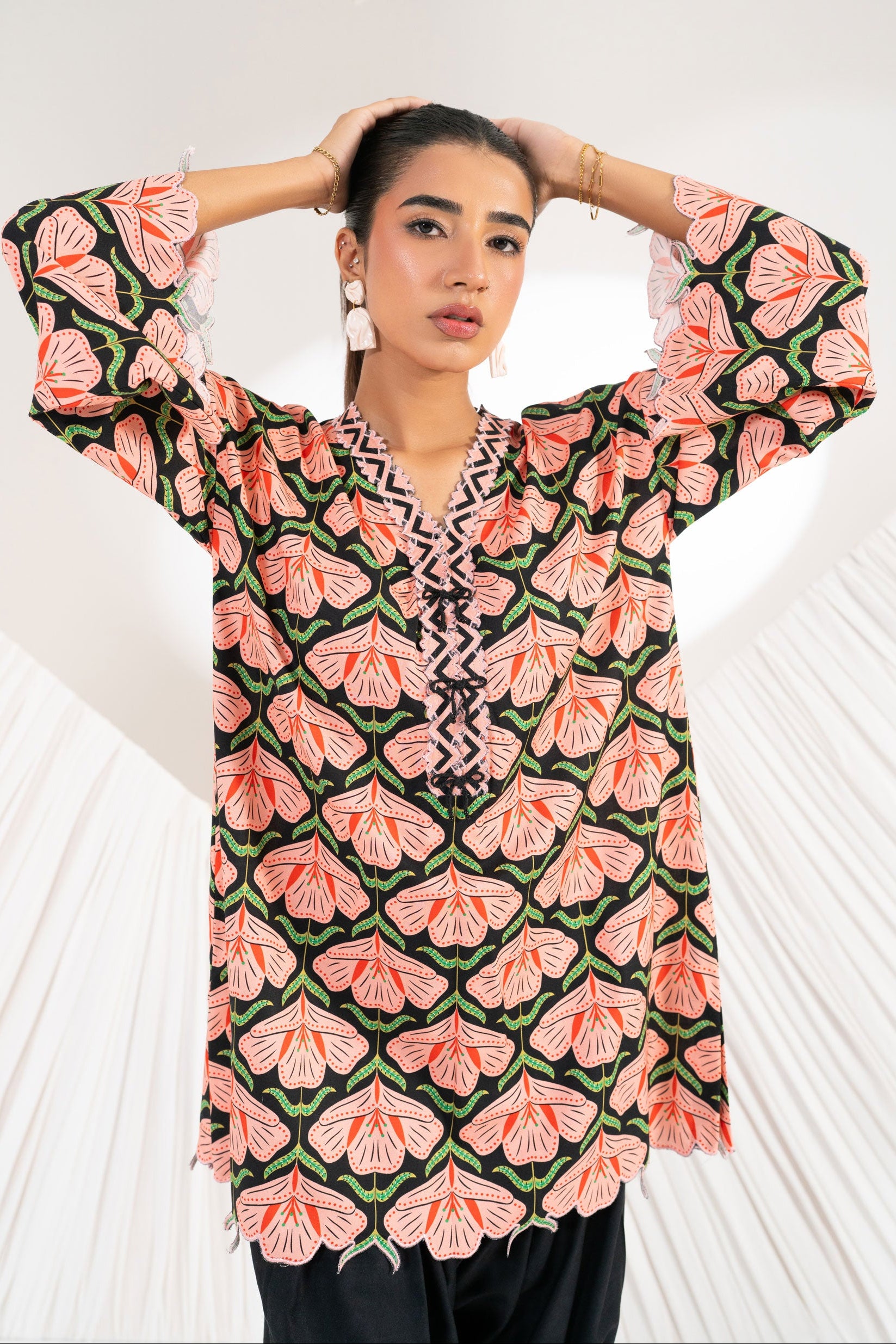 Woman wearing a patterned dress with a white heart-shaped background