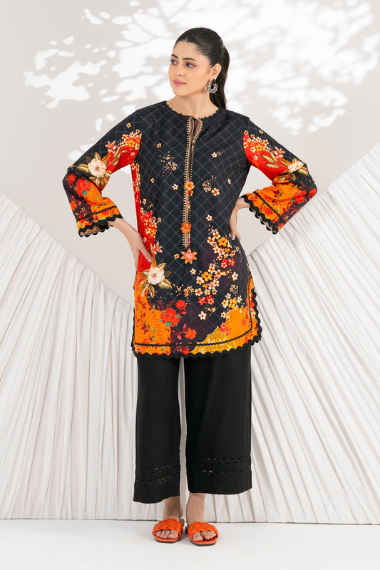 Woman wearing a colorful traditional outfit with a decorative background